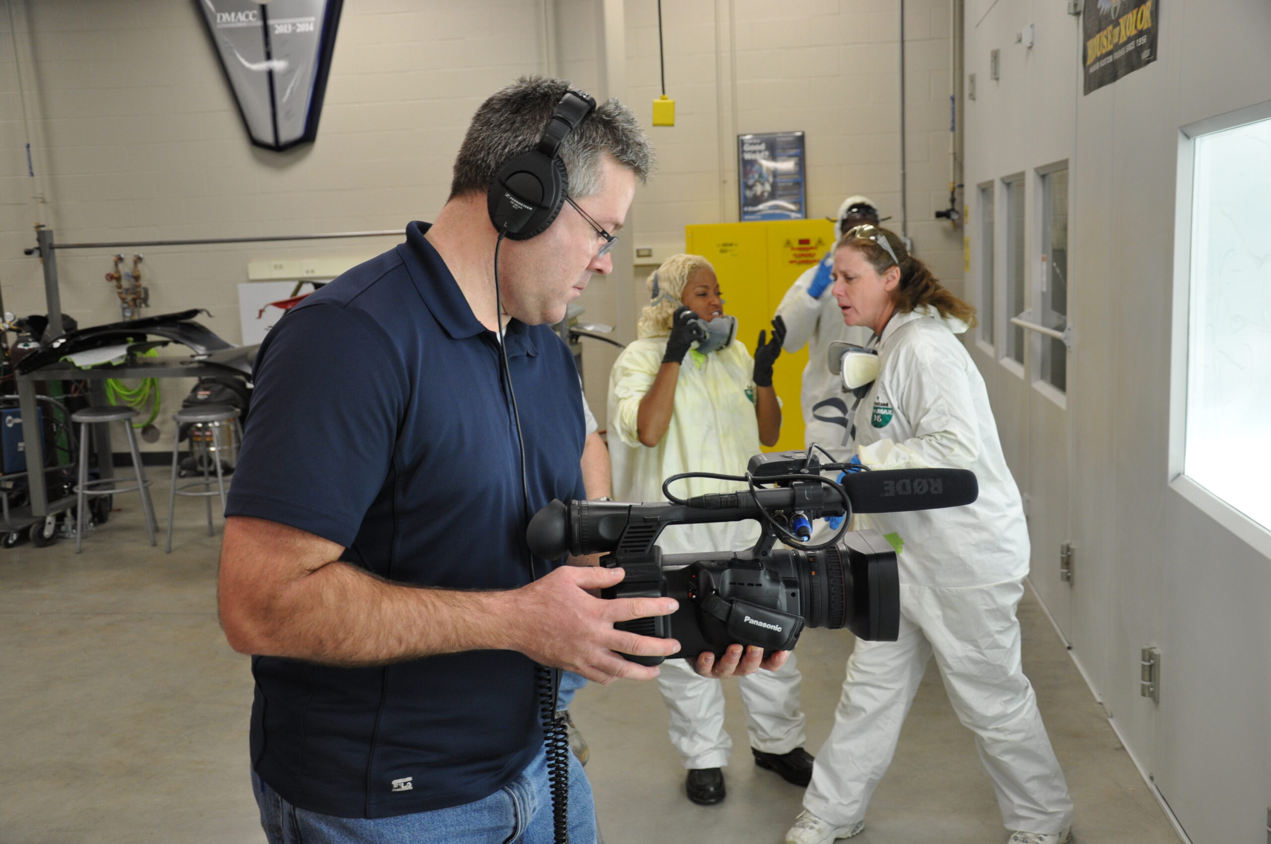Shawn working with a camera indoors.